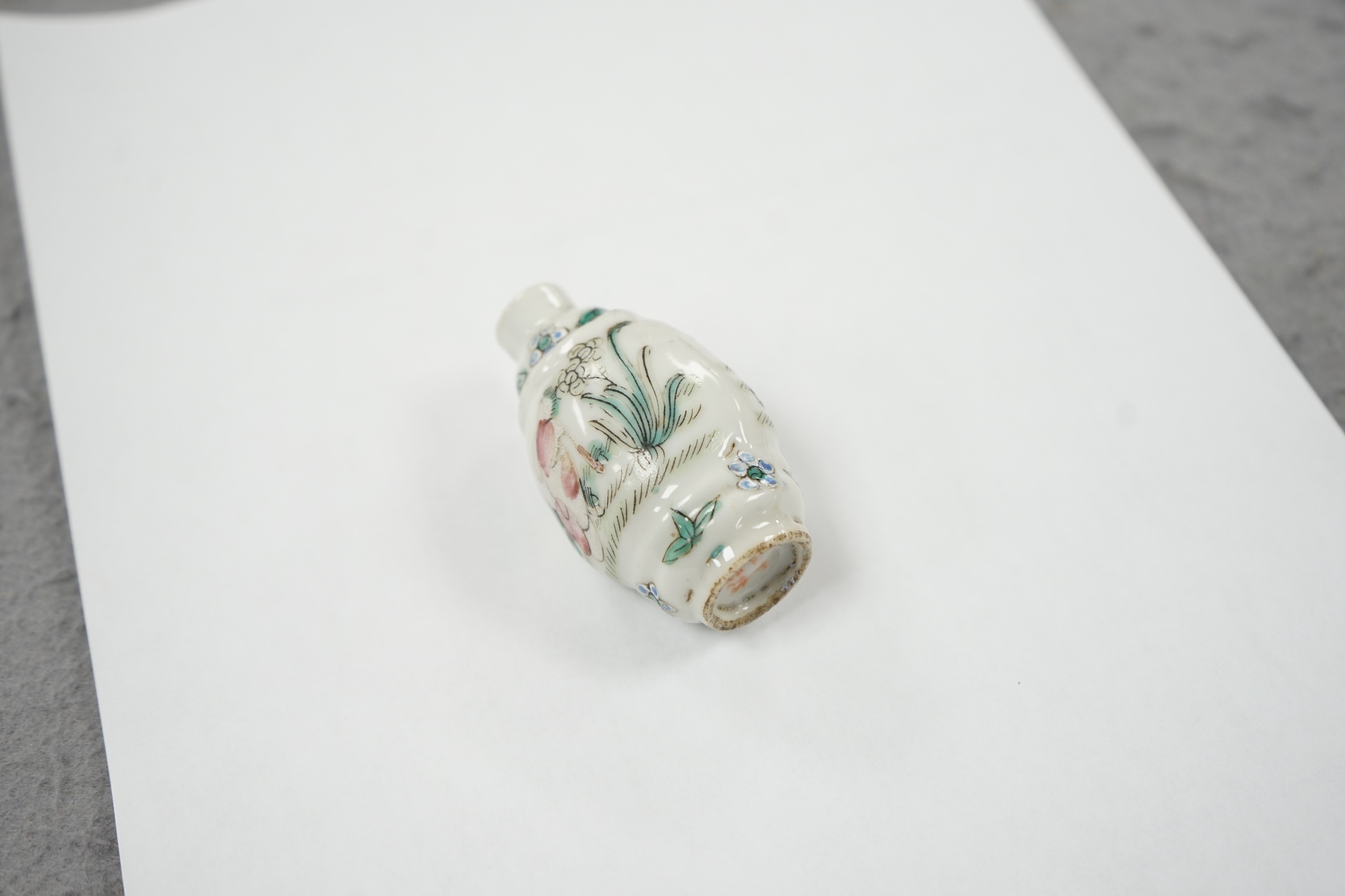 A Chinese famille rose snuff bottle, decorated with rams, Qianlong mark, 1850-1900, 6.7 cm high